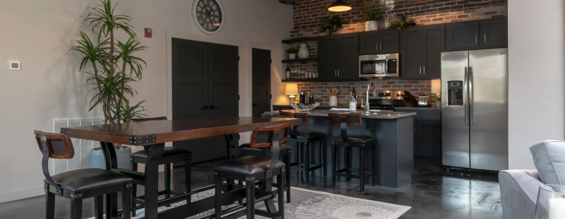 a kitchen with a table and chairs